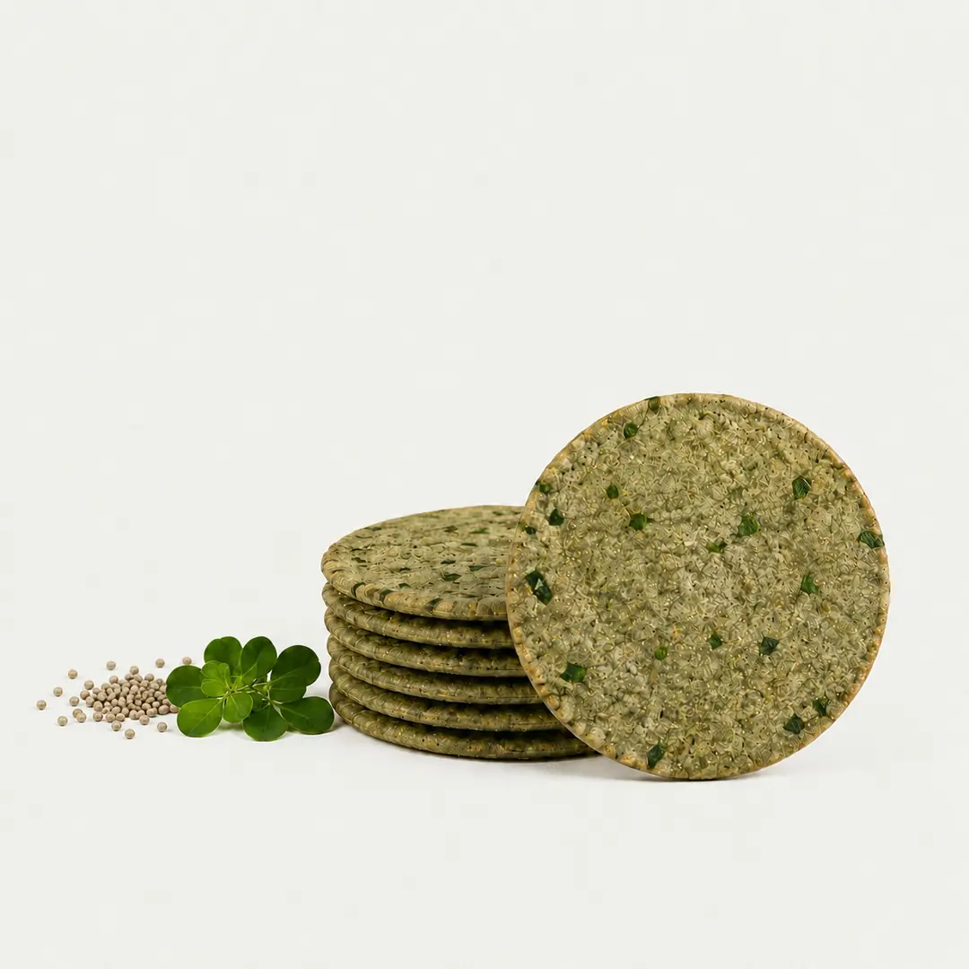 Wheatella Bajri Methi coin khakhra with pearl millet grains and fresh methi leaves